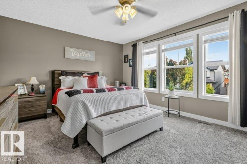 Spacious bedroom featuring light neutral wall paint and plush carpeting - 5322 Terwillegar Boulevard Nw, Edmonton, AB - Indoor Photo Showing Bedroom