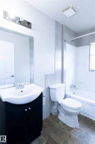 Bathroom with vanity and shower / bathtub combination - 11029 95 Street Nw, Edmonton, AB - Indoor Photo Showing Bathroom