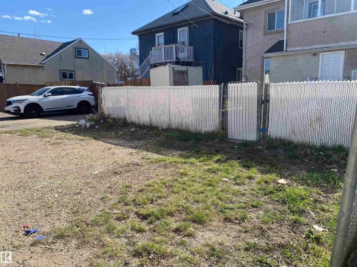 Gravel lot featuring partial chain-link fencing with a gate - 11029 95 Street Nw, Edmonton, AB - Outdoor