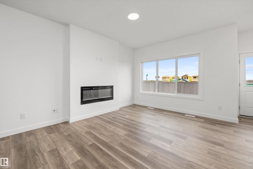 17623 7 Street Ne, Edmonton, AB - Indoor Photo Showing Living Room With Fireplace