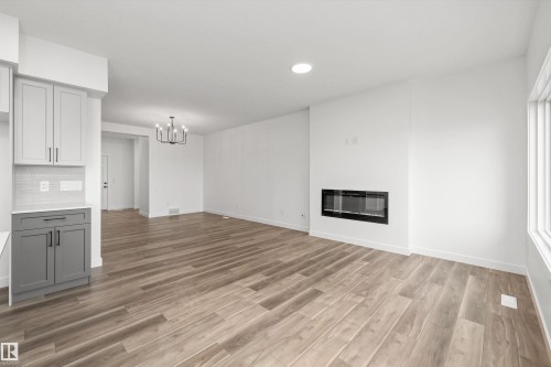 17623 7 Street Ne, Edmonton, AB - Indoor Photo Showing Other Room With Fireplace