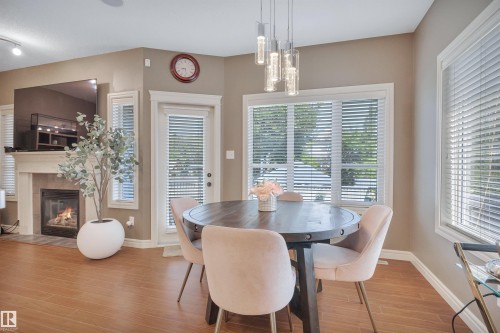 2289 Austin Way Sw, Edmonton, AB - Indoor Photo Showing Dining Room With Fireplace