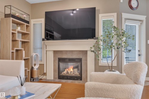 2289 Austin Way Sw, Edmonton, AB - Indoor Photo Showing Living Room With Fireplace