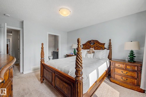 Plush carpeting, light-toned wall paint, and a ceiling-mounted light fixture - 1783 Keene Crescent Sw, Edmonton, AB - Indoor Photo Showing Bedroom