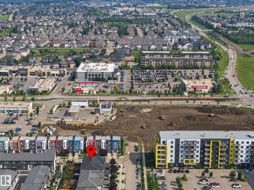 Residential neighborhood setting with varied architectural styles and commercial properties - 1783 Keene Crescent Sw, Edmonton, AB - Outdoor With View