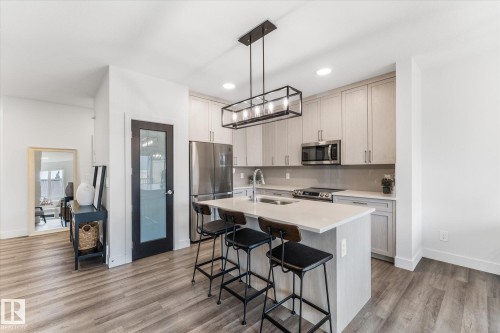 72 Spruce Gardens Crescent, Spruce Grove, AB - Indoor Photo Showing Kitchen With Stainless Steel Kitchen With Double Sink With Upgraded Kitchen
