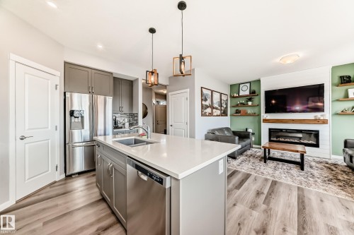 17207 64 Street Nw, Edmonton, AB - Indoor Photo Showing Kitchen With Fireplace With Stainless Steel Kitchen With Double Sink With Upgraded Kitchen