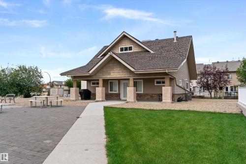 Charming residence featuring a pitched gable roof with architectural detailing, composite shingle roofing, and a covered front entry - #305A 6 Spruce Ridge Dr, Spruce Grove, AB - Outdoor