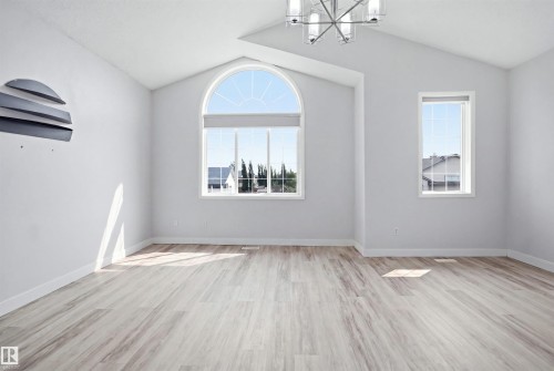 Vaulted ceilings featuring a contemporary chandelier - 714 87 Street Sw, Edmonton, AB - Indoor Photo Showing Other Room