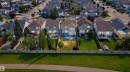 Residential neighborhood with a variety of two-story homes, individual fenced yards, and mature landscaping - 714 87 Street Sw, Edmonton, AB  - Outdoor With Facade With View 