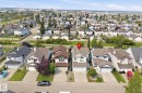 Two-story residence with an attached front-facing garage, a gabled roofline, and dormer windows - 714 87 Street Sw, Edmonton, AB  - Outdoor With View 