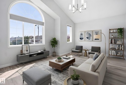 Vaulted ceiling living area featuring a large arched window, wood-finish flooring, and a contemporary chandelier - 714 87 Street Sw, Edmonton, AB - Indoor Photo Showing Living Room