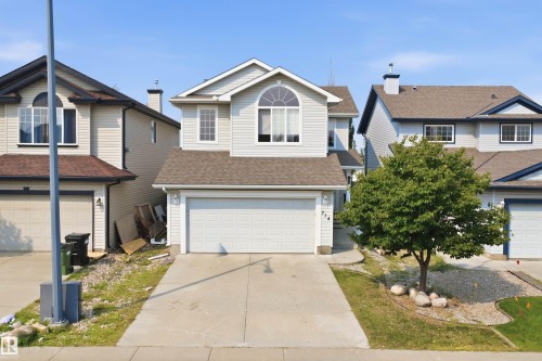 Two-story residence featuring light-colored siding and a two-car garage - 714 87 Street Sw, Edmonton, AB - Outdoor With Facade