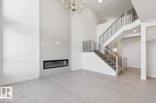5033 Cawsey Link Sw, Edmonton, AB - Indoor Photo Showing Other Room With Fireplace