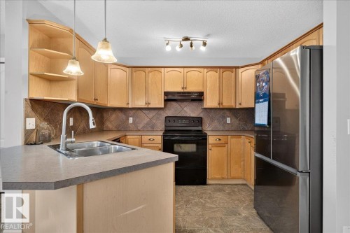 Kitchen - 887 Oakland Boulevard, Devon, AB - Indoor Photo Showing Kitchen With Double Sink