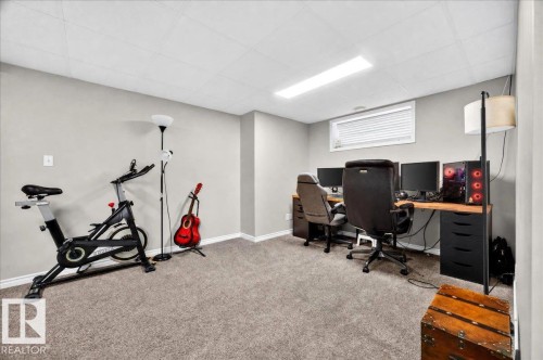 Finished basement featuring carpeted flooring, recessed lighting, and versatile space configured for multiple uses - 887 Oakland Boulevard, Devon, AB - Indoor Photo Showing Other Room