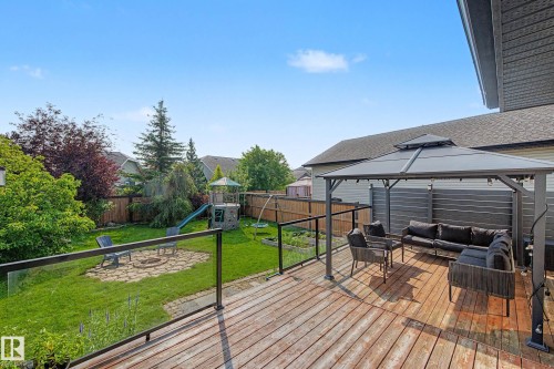 Spacious wooden deck featuring a built-in gazebo with an integrated privacy screen - 21 Nash Close, St. Albert, AB - Outdoor With Deck Patio Veranda