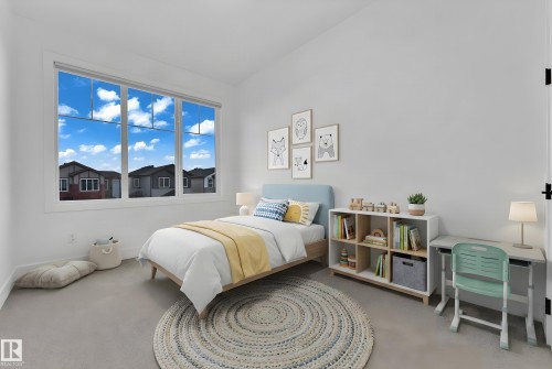 Expansive window framing the exterior, light gray wall finish, and neutral carpet flooring - 4303 36 Street, Beaumont, AB - Indoor Photo Showing Bedroom