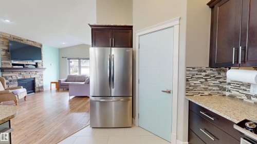 3809 52 Av, Drayton Valley, AB - Indoor Photo Showing Kitchen With Fireplace