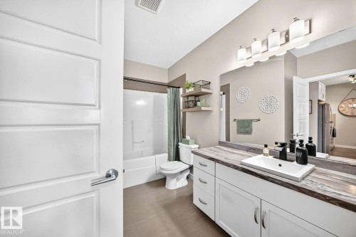 White panel door with satin nickel hardware - #238 1008 Rosenthal Bv Nw, Edmonton, AB - Indoor Photo Showing Bathroom