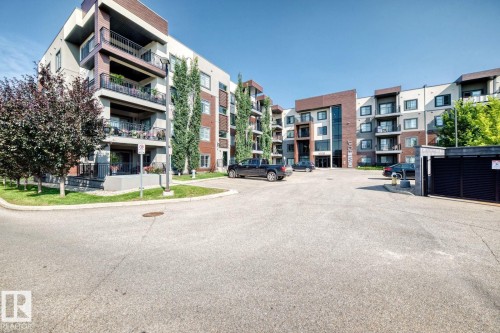 Multi-story residential building with a brick and stucco facade - #238 1008 Rosenthal Bv Nw, Edmonton, AB - Outdoor With Balcony With Facade