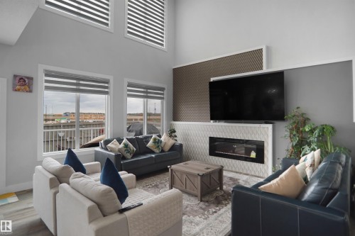 4709 Charles Bay Sw, Edmonton, AB - Indoor Photo Showing Living Room With Fireplace