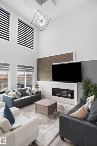 4709 Charles Bay Sw, Edmonton, AB - Indoor Photo Showing Living Room With Fireplace