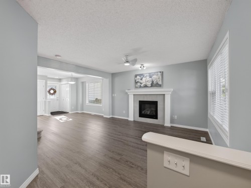 7835 Schmid Place Nw, Edmonton, AB - Indoor Photo Showing Living Room With Fireplace