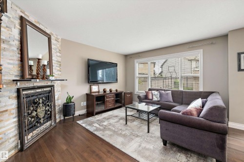 17332 6 Avenue Sw, Edmonton, AB - Indoor Photo Showing Living Room With Fireplace