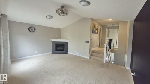 131 57 Street Sw, Edmonton, AB - Indoor Photo Showing Living Room With Fireplace