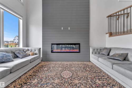 5208 23A Avenue Sw, Edmonton, AB - Indoor Photo Showing Living Room With Fireplace