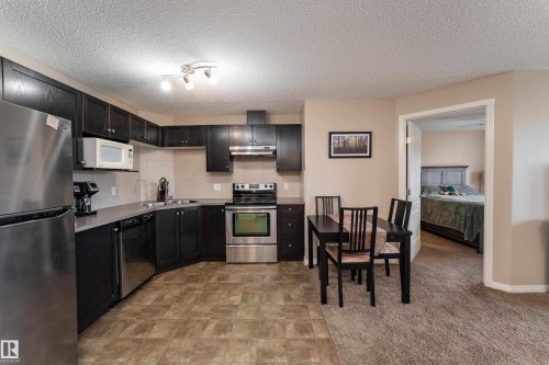 #339 1520 Hammond Ga Nw, Edmonton, AB - Indoor Photo Showing Kitchen With Stainless Steel Kitchen