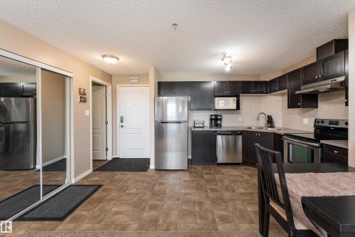 #339 1520 Hammond Ga Nw, Edmonton, AB - Indoor Photo Showing Kitchen With Stainless Steel Kitchen