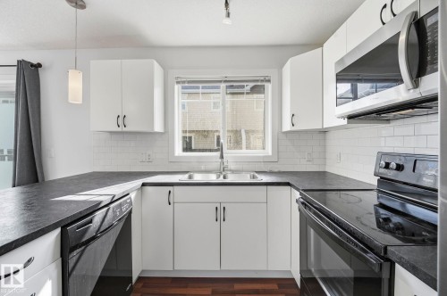 #18 13810 166 Av Nw, Edmonton, AB - Indoor Photo Showing Kitchen With Double Sink