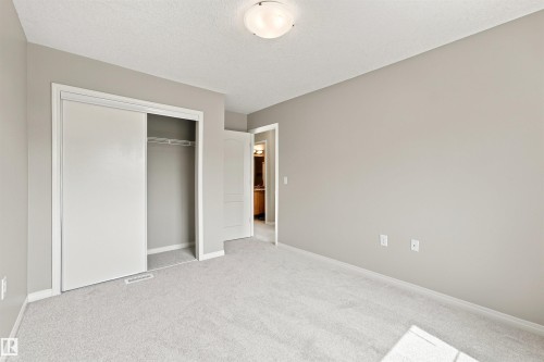 Neutral-toned walls complement plush carpeting throughout this room - #144 104 West Haven Dr, Leduc, AB - Indoor Photo Showing Other Room