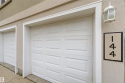 White panel garage doors with white trim - 