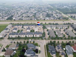 Aerial perspective showcasing a residential neighborhood with diverse housing styles - 