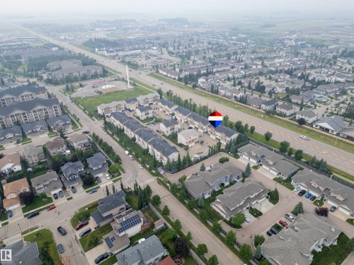 Aerial perspective showcasing a residential community with varied housing styles - #144 104 West Haven Dr, Leduc, AB - Outdoor With View