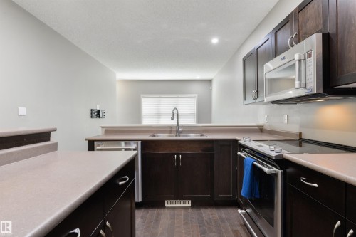7058 Cardinal Way Sw, Edmonton, AB - Indoor Photo Showing Kitchen With Double Sink