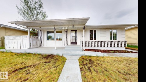 Single-story home featuring a covered front entry and a concrete walkway - 12812 45 Street Nw, Edmonton, AB - Outdoor
