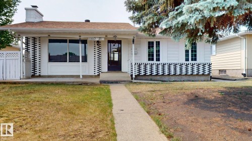 Single-story residence featuring a white exterior with distinctive black and white patterned accents - 12812 45 Street Nw, Edmonton, AB - Outdoor