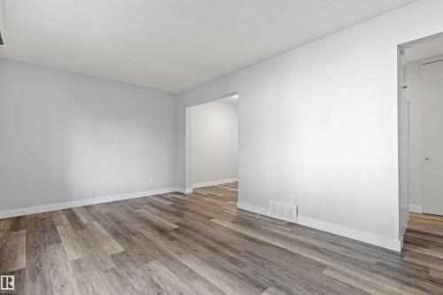 Wood-finish flooring - #9 14230 80 St Nw, Edmonton, AB - Indoor Photo Showing Other Room