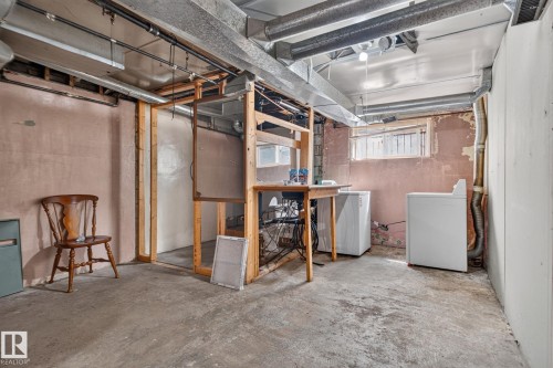 Lower-level utility area with exposed ductwork, concrete flooring, and partial framing - 9921 109 Street, Fort Saskatchewan, AB - Indoor Photo Showing Basement