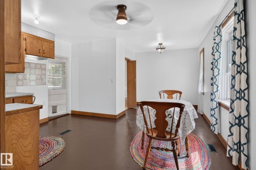 Wood-finish flooring with white walls and natural wood trim throughout - 9921 109 Street, Fort Saskatchewan, AB - Indoor
