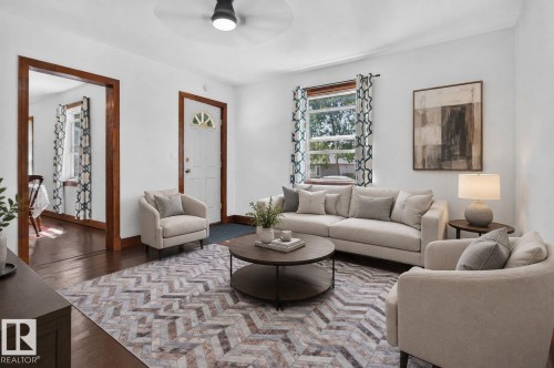 Hardwood flooring, recessed lighting, and a ceiling fan create a comfortable atmosphere - 9921 109 Street, Fort Saskatchewan, AB - Indoor Photo Showing Living Room