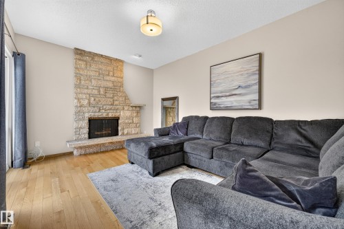 11727 27 Avenue Nw, Edmonton, AB - Indoor Photo Showing Living Room With Fireplace