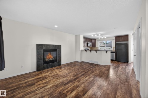 3634 12 Street Nw, Edmonton, AB - Indoor Photo Showing Living Room With Fireplace
