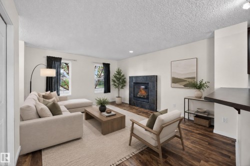3634 12 Street Nw, Edmonton, AB - Indoor Photo Showing Living Room With Fireplace