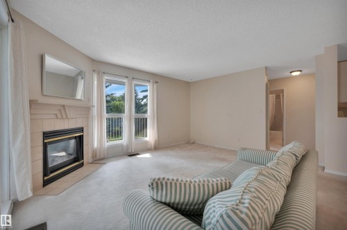 #209 65 Gervais Rd, St. Albert, AB - Indoor Photo Showing Living Room With Fireplace