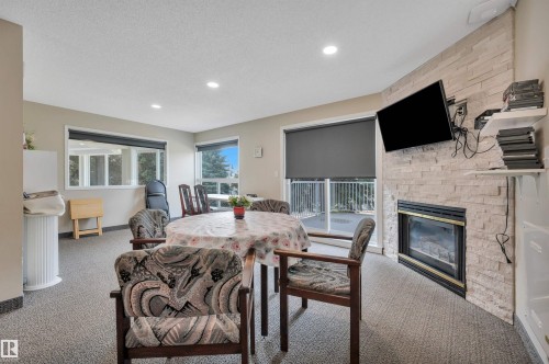 #209 65 Gervais Rd, St. Albert, AB - Indoor With Fireplace